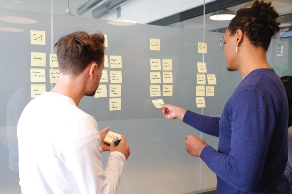 Two people working together on a quarterly planning project.