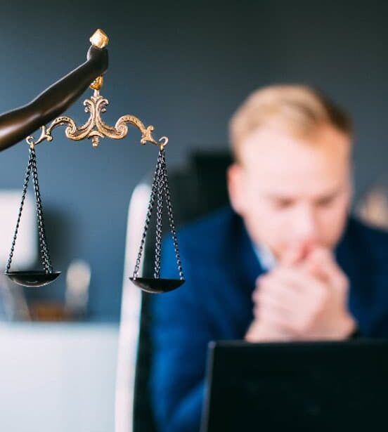 man in government office looking at computer