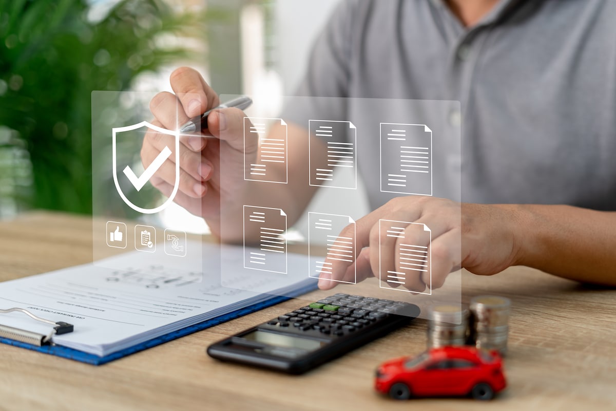 On-line document verification on a virtual screen concept,Officers check quality assurance and use a calculator to calculate expenses of cyber insurance.