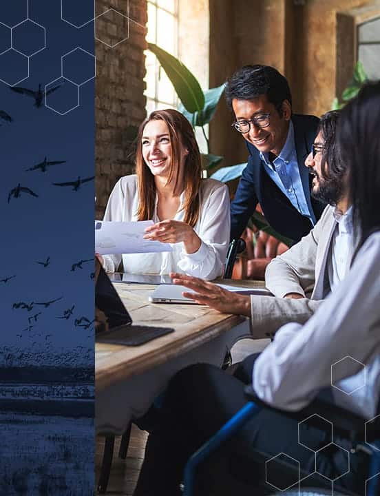 coworkers-gathered-around-table