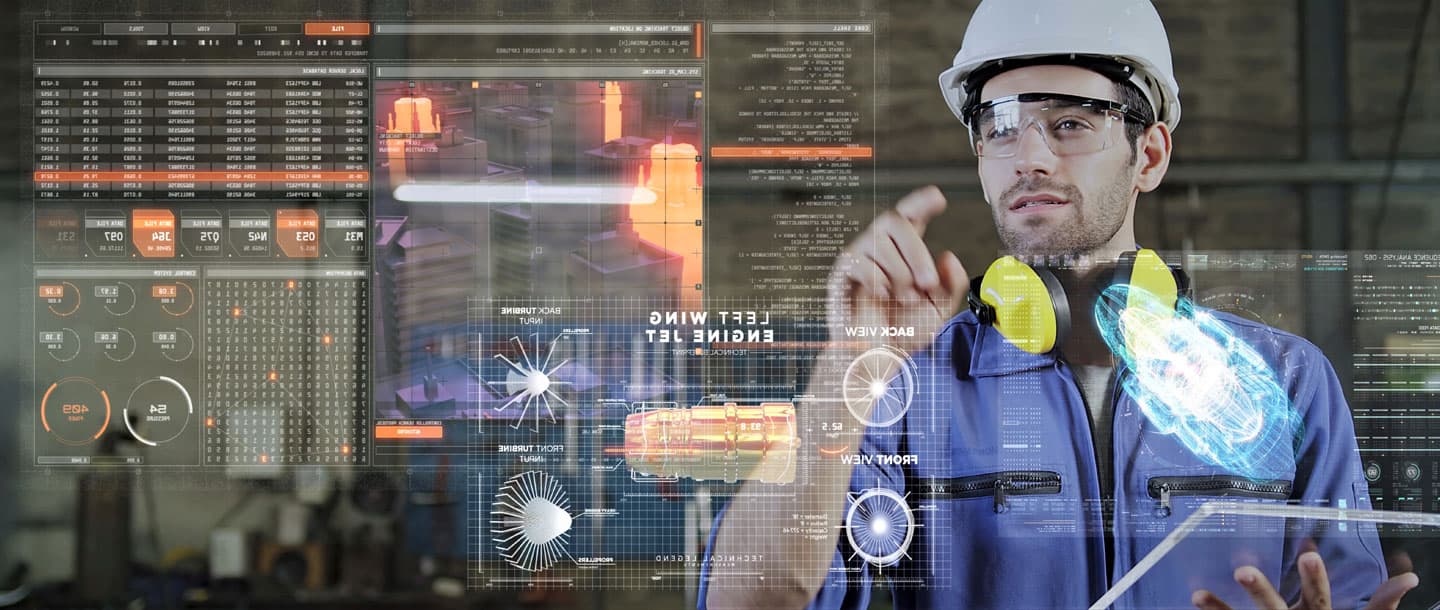 man in hardhat looking at data