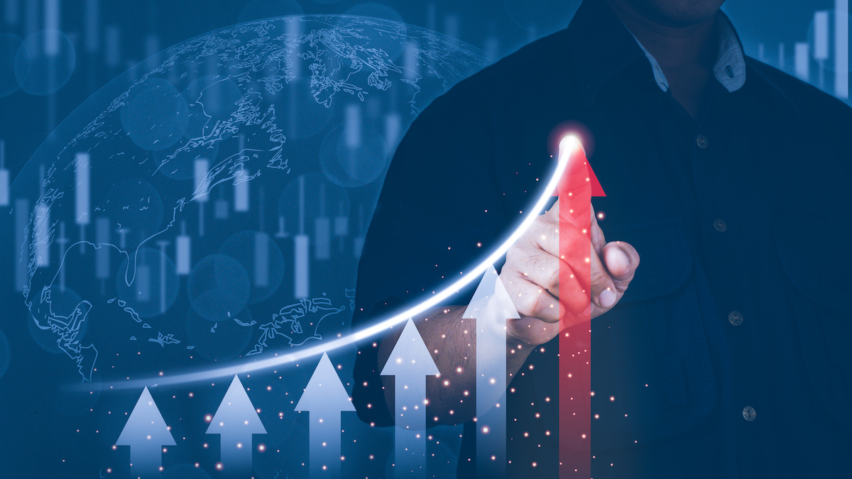 Businessman pointing red arrow graph corporate productivity growth plan.