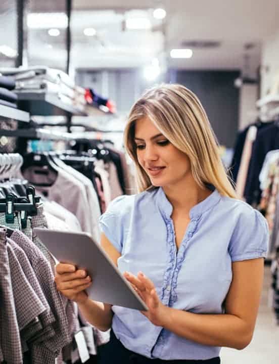 retail industry worker using laptop for inventory