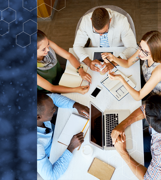 coworkers-gathered-around-table