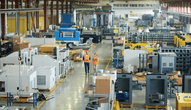 workers on the floor of a manufacturing plant