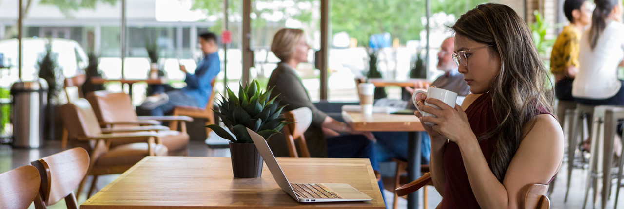 woman-in-cafe-working-on-computer